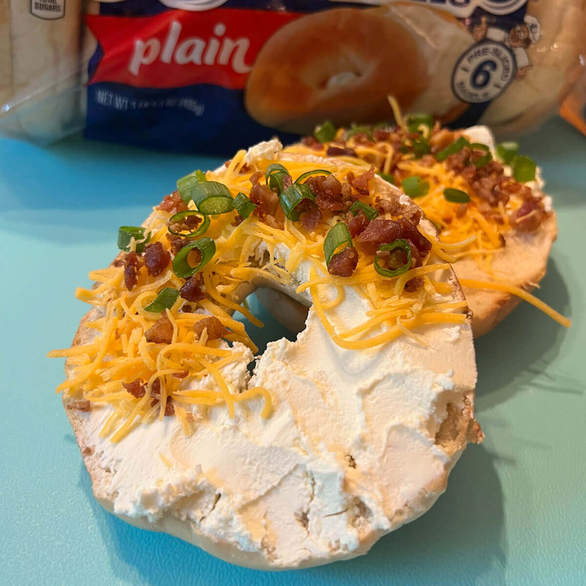 Bacon Cheddar and Chive topped bagel